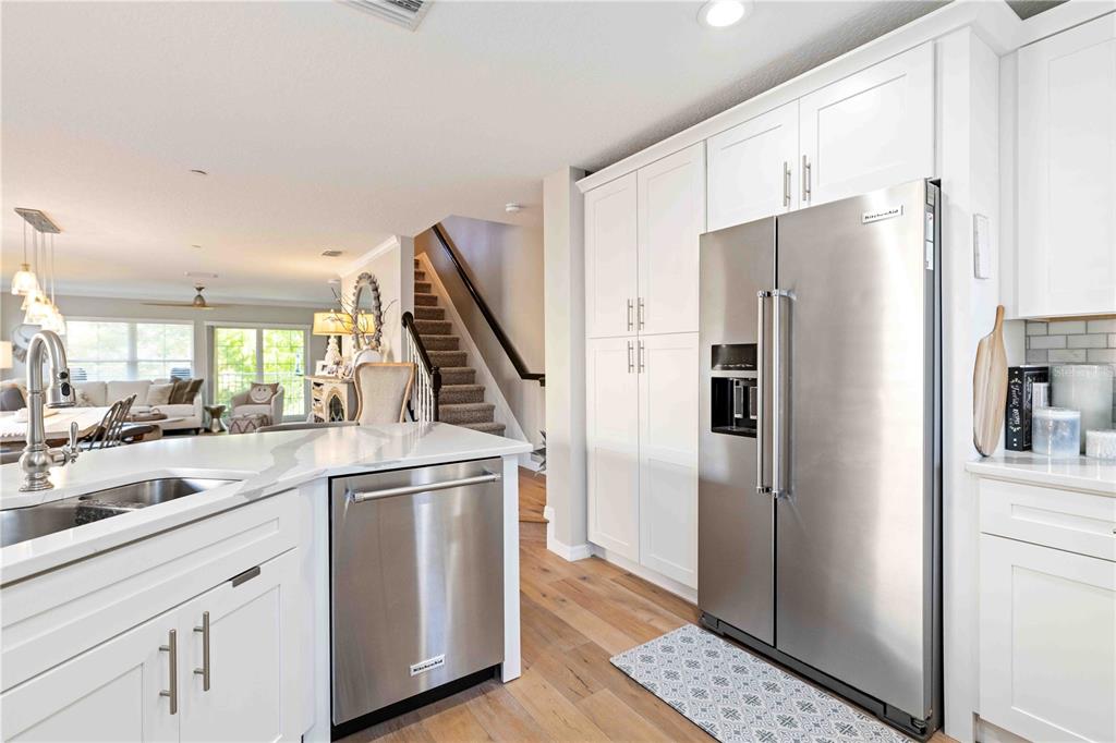 9040 White Sage Loop Lakewood Ranch, FL 34202 - Photo 42 of 59 a kitchen with a refrigerator and a sink