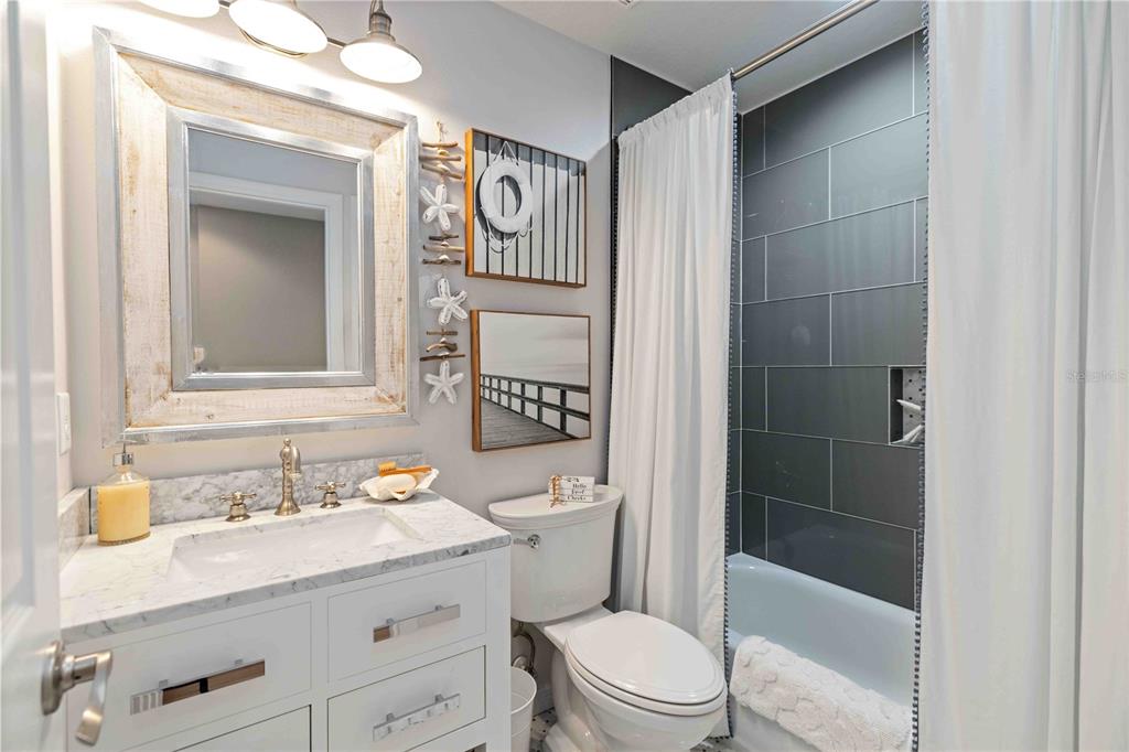 9040 White Sage Loop Lakewood Ranch, FL 34202 - Photo 48 of 59 a bathroom with a sink a toilet and shower