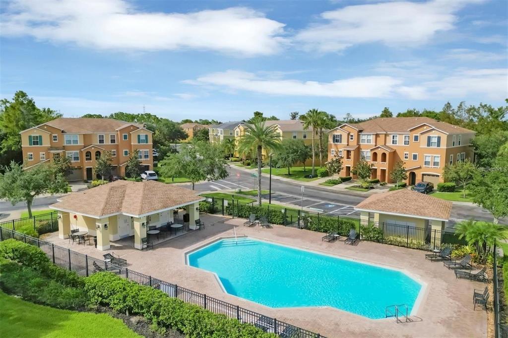 9040 White Sage Loop Lakewood Ranch, FL 34202 - Photo 58 of 59 a view of a house with a big yard and large trees