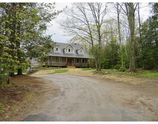 208 Reservoir Road Westhampton, MA 01027 - Photo 1 of 30 a front view of a house with a garden
