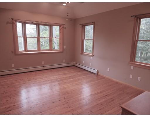 208 Reservoir Road Westhampton, MA 01027 - Photo 13 of 30 an empty room with wooden floor and windows