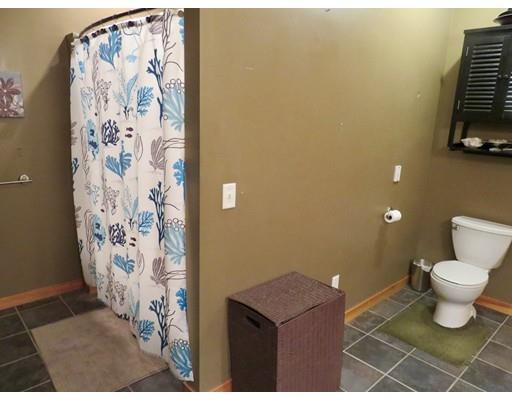 208 Reservoir Road Westhampton, MA 01027 - Photo 18 of 30 a bathroom with a toilet and a shower curtain