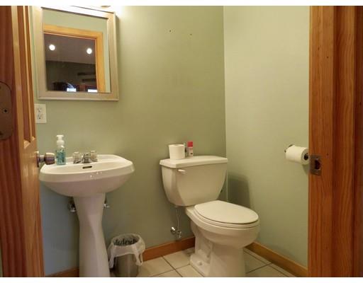 208 Reservoir Road Westhampton, MA 01027 - Photo 19 of 30 a bathroom with a toilet a sink and mirror