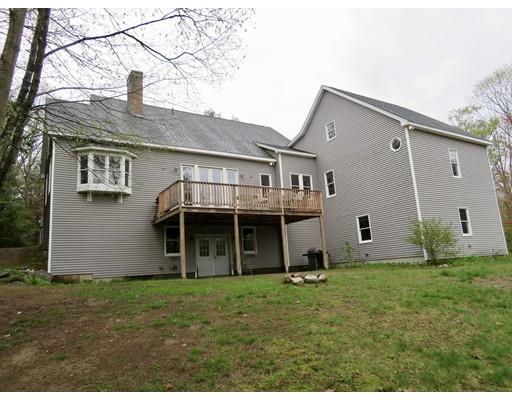 208 Reservoir Road Westhampton, MA 01027 - Photo 30 of 30 a backyard of a house with potted plants and a large tree