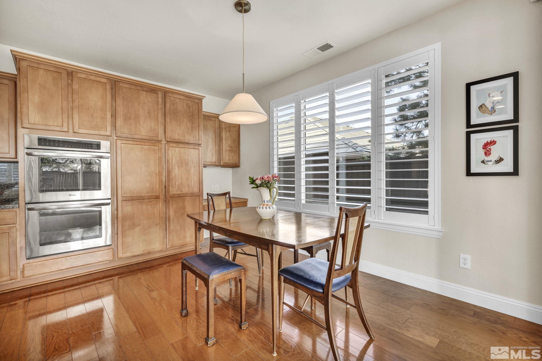 665 Paso Fino Court Reno, NV 89521 - Photo 3 of 40 a view of a dining room with furniture window and outside view