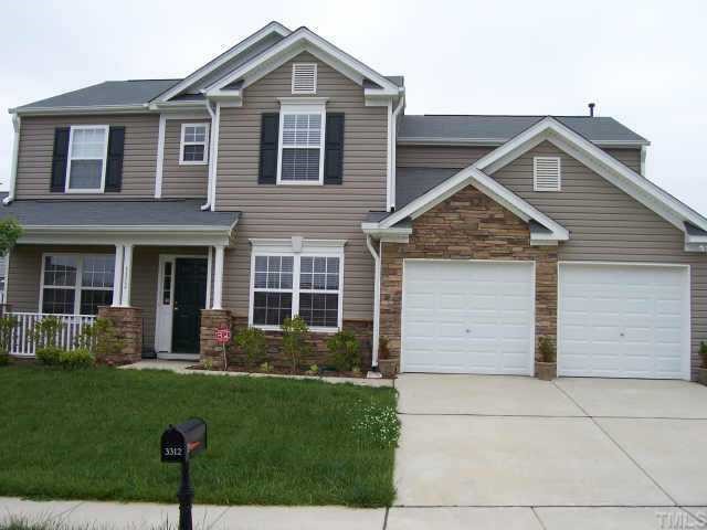 3312 Baseline Road Raleigh, NC 27610 - Photo 1 of 1 a front view of a house with a yard and garage