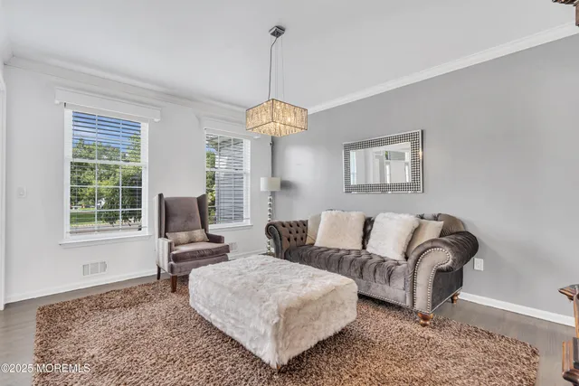 a room with a white bed and a window