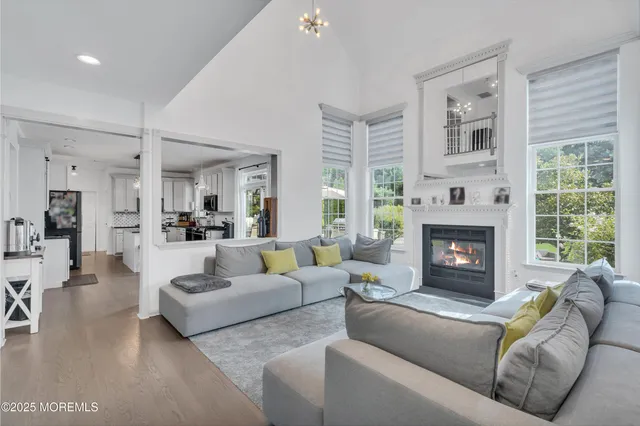 a bedroom with bed and a large window