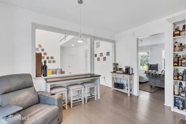 a view of a chair and table in backyard of the house