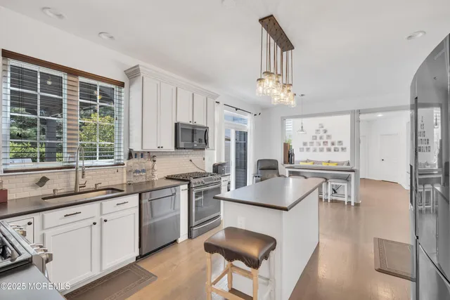 an aerial view of a house with a garden and trees