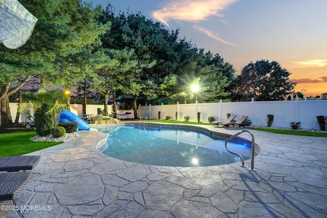 a view of an entryway with wooden floor and door