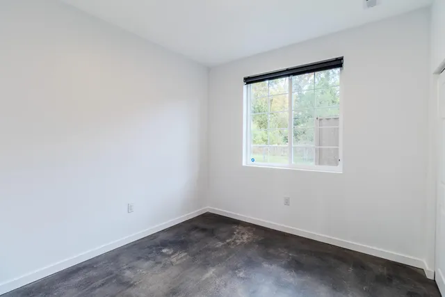 a view of a hallway with closet and entryway