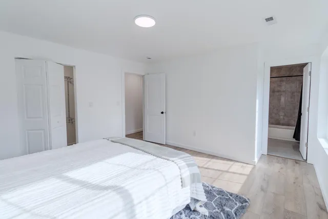 a bathroom with a shower a toilet and a shower