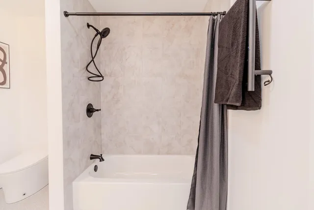 a bathroom with a double vanity sink and mirror