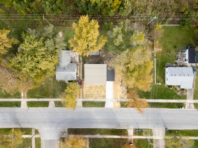 a picture of a bench in front of a wall