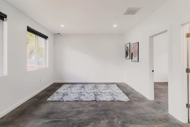 a view of a hallway with a lot of wall paintings