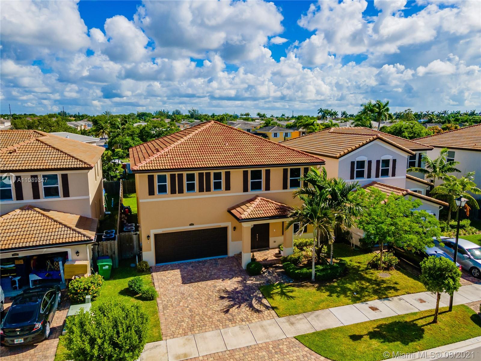 12119 Southwest 253rd Street Homestead, FL 33032 - Photo 2 of 46 a aerial view of a house with yard porch and furniture