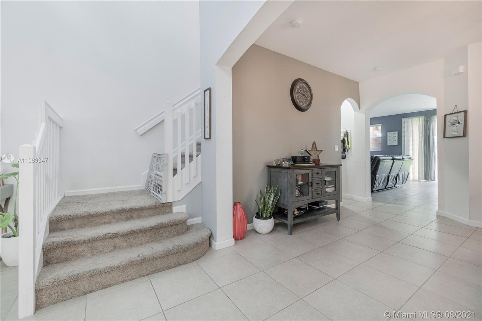 12119 Southwest 253rd Street Homestead, FL 33032 - Photo 11 of 46 a view of entryway with livingroom and furniture
