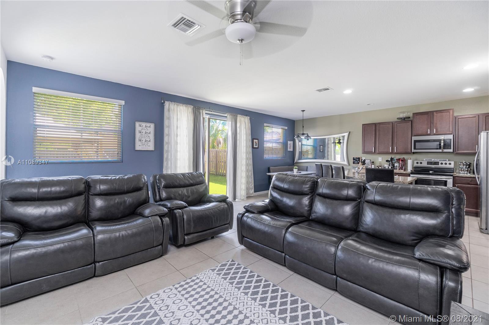 12119 Southwest 253rd Street Homestead, FL 33032 - Photo 20 of 46 a living room with furniture and a window