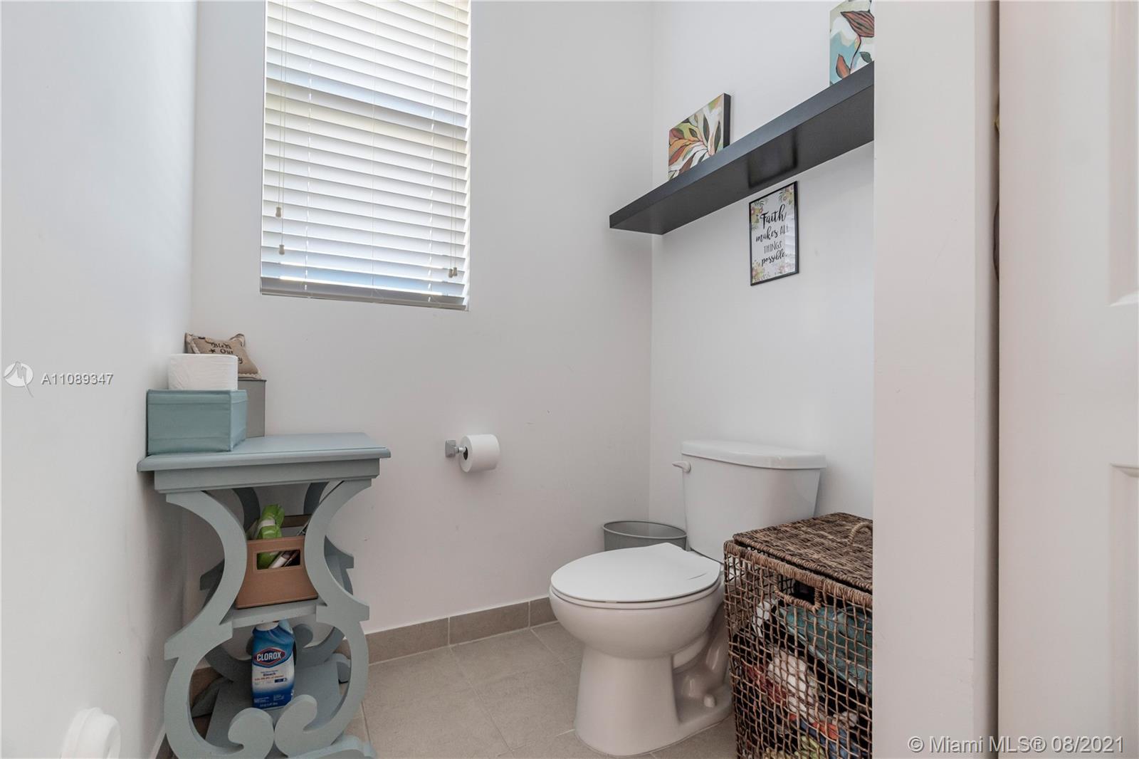 12119 Southwest 253rd Street Homestead, FL 33032 - Photo 34 of 46 a bathroom with a toilet and a sink