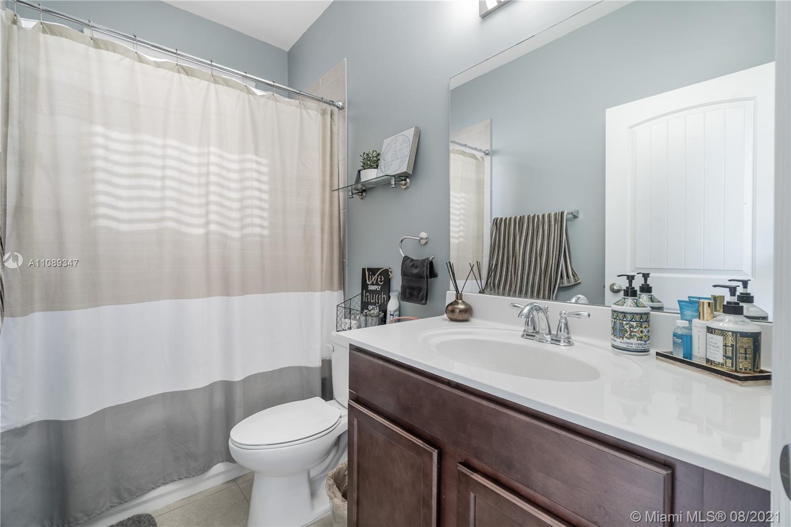 12119 Southwest 253rd Street Homestead, FL 33032 - Photo 40 of 46 a bathroom with a sink toilet and shower