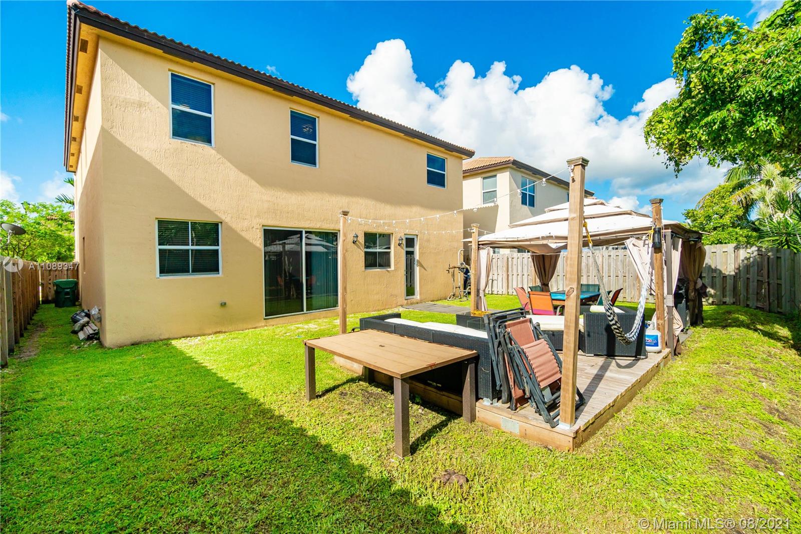 12119 Southwest 253rd Street Homestead, FL 33032 - Photo 43 of 46 a view of a house with backyard and sitting area