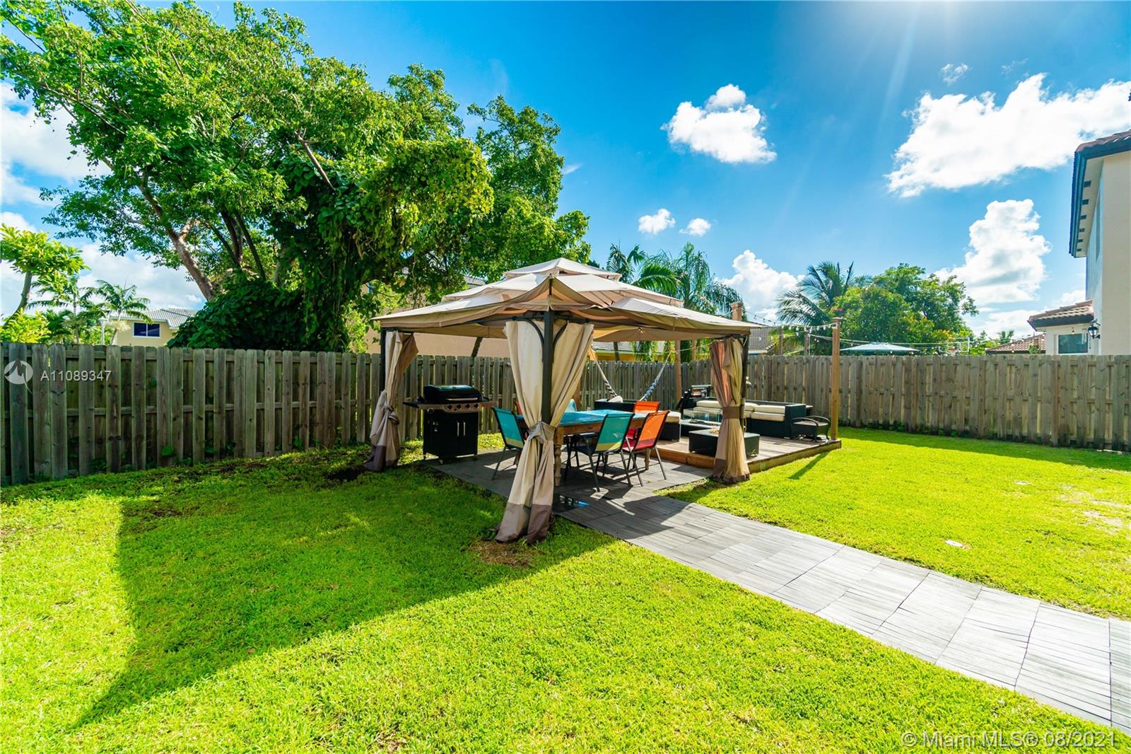 12119 Southwest 253rd Street Homestead, FL 33032 - Photo 45 of 46 a view of a backyard with a garden and entertaining space