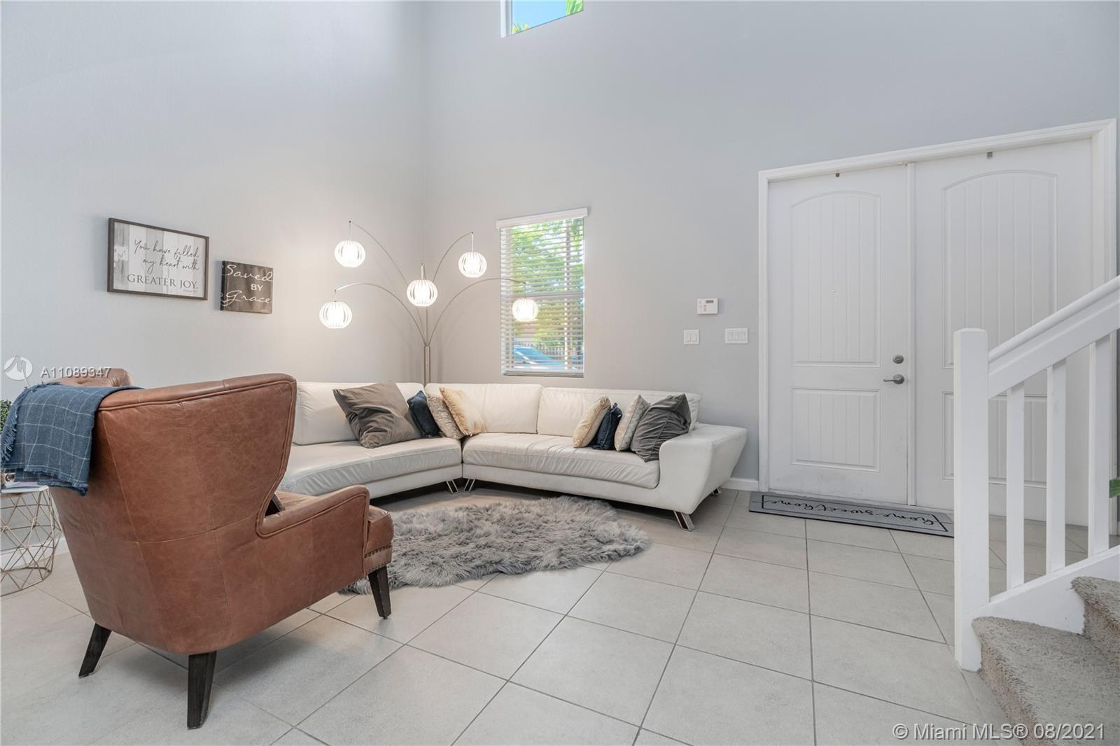 12119 Southwest 253rd Street Homestead, FL 33032 - Photo 10 of 46 a living room with furniture and a window