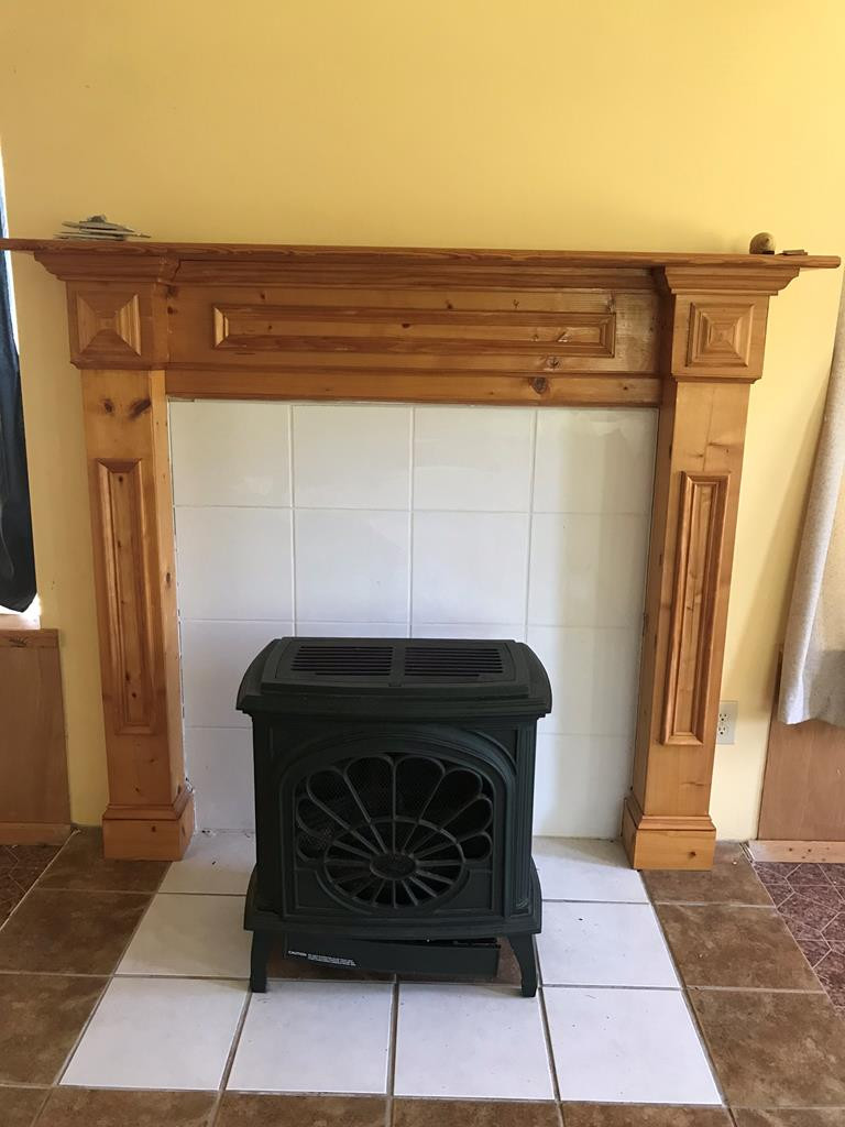 895 Hancock Landing Road Waynesboro, GA 30830 - Photo 29 of 41 Wood burning stove in sunroom