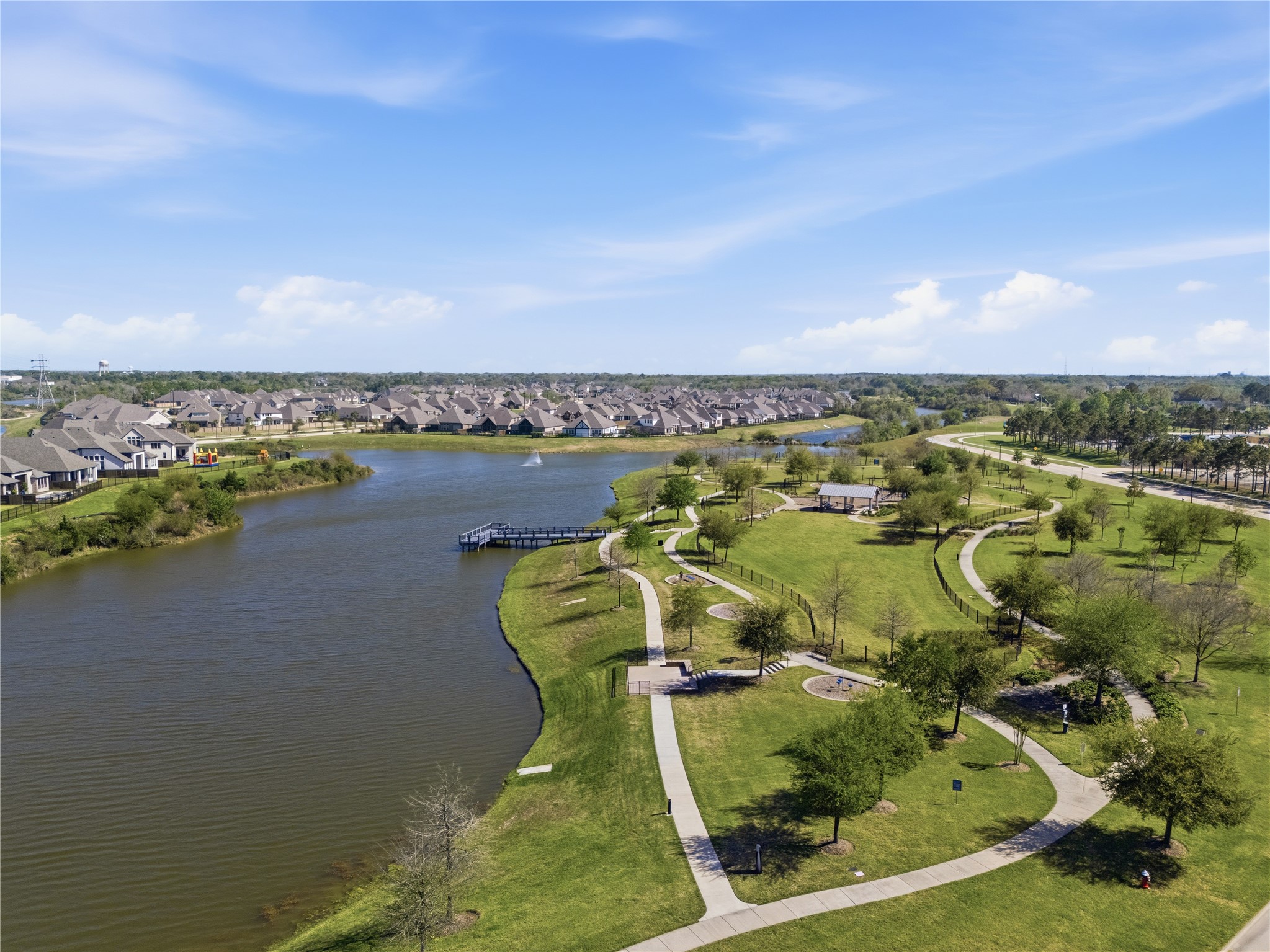 416 Bartlett Street Webster, TX 77598 - Photo 49 of 49 Aerial of Lady Ann Lake with waterfront fishing pier, walking trails, and park green space