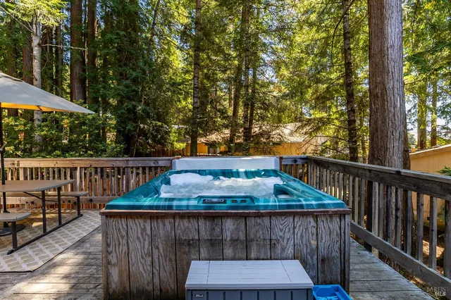 a view of a house with wooden deck
