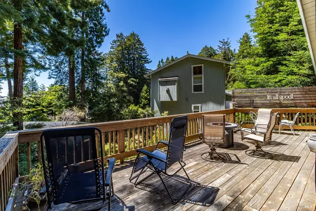 a view of a house with wooden fence