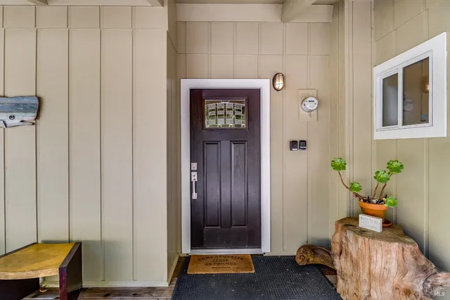 a view of a house with wooden deck