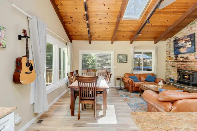 a view of balcony with wooden floor and outdoor seating