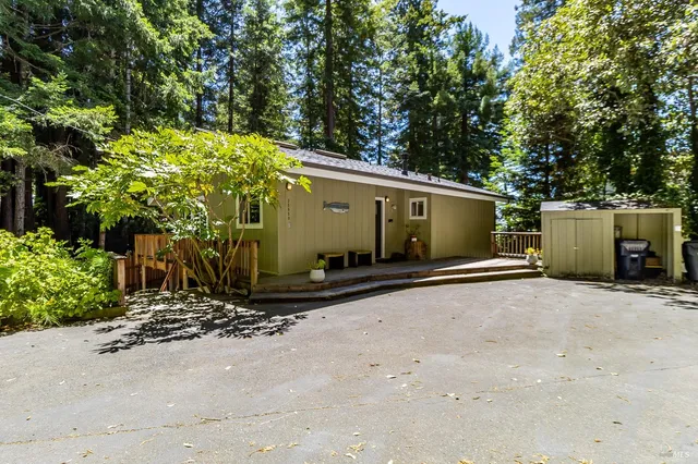 a balcony with wooden floor and outdoor seating