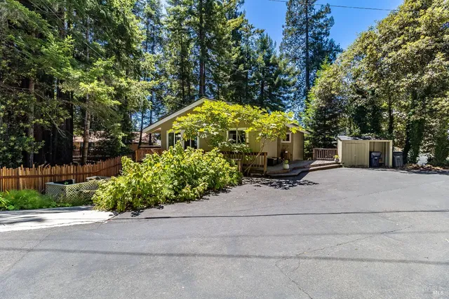 a balcony with wooden floor and outdoor seating