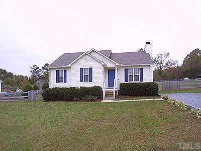 4020 Rockside Hills Drive Raleigh, NC 27603 - Photo 1 of 1 a front view of a house with a yard