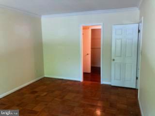 15 Cross Keys Road, Unit E Baltimore, MD 21210 - Photo 24 of 35 Master BR w/ wood floors and crown molding