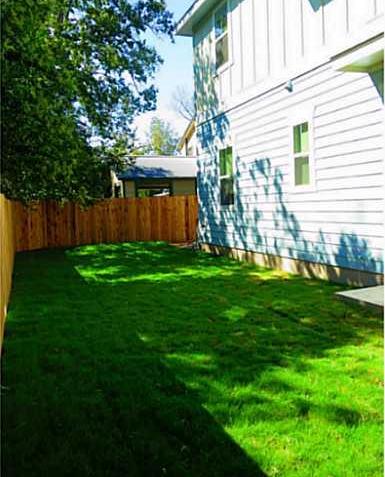 4420 Red River Street, Unit B Austin, TX 78751 - Photo 11 of 11 A well-maintained side yard with a sturdy privacy fence provides an ideal outdoor retreat.