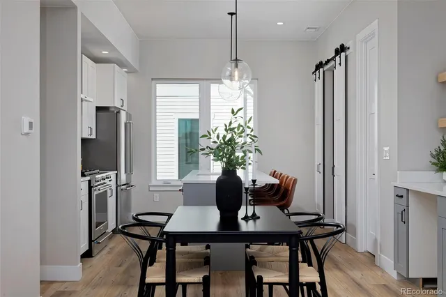 a view of a dining room with furniture window and wooden floor