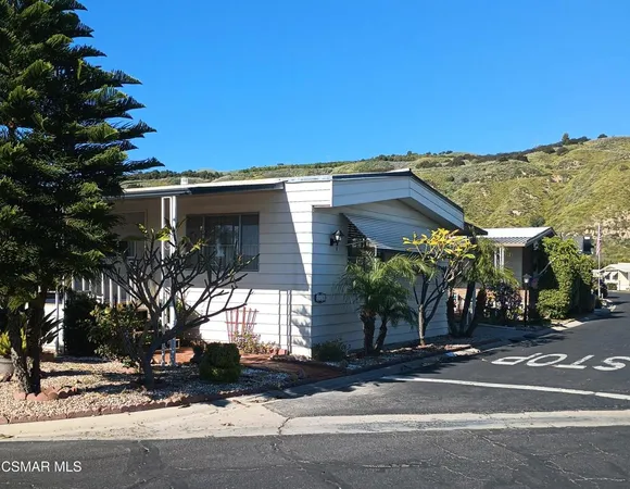 a view of a house with a street