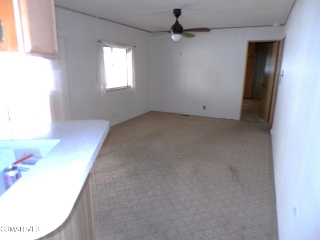250 East Telegraph Road, Unit 220 Fillmore, CA 93015 - Photo 14 of 24 an empty room with a window and a ceiling fan