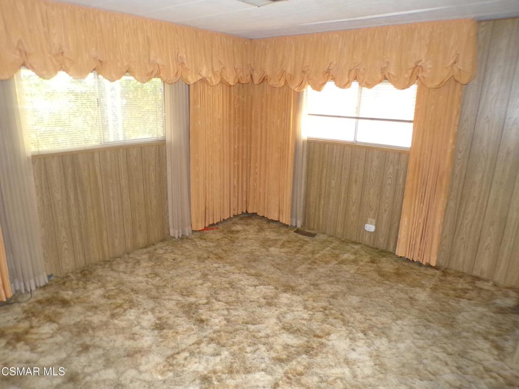 250 East Telegraph Road, Unit 220 Fillmore, CA 93015 - Photo 16 of 24 a view of an empty room and window