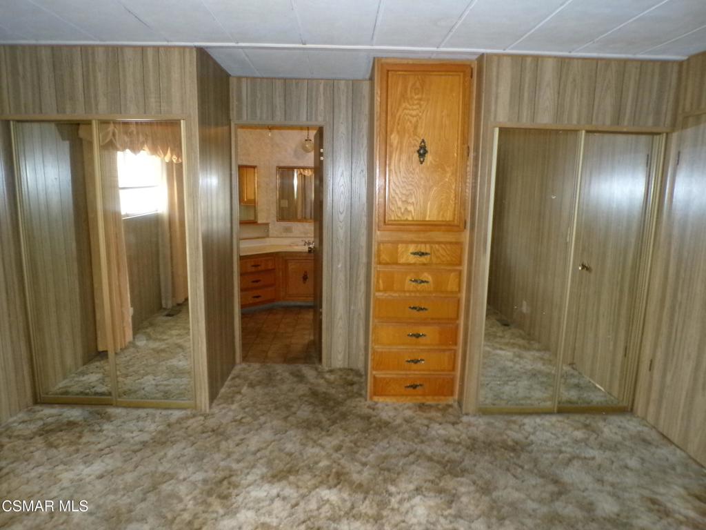 250 East Telegraph Road, Unit 220 Fillmore, CA 93015 - Photo 17 of 24 an empty room with closet and wooden door