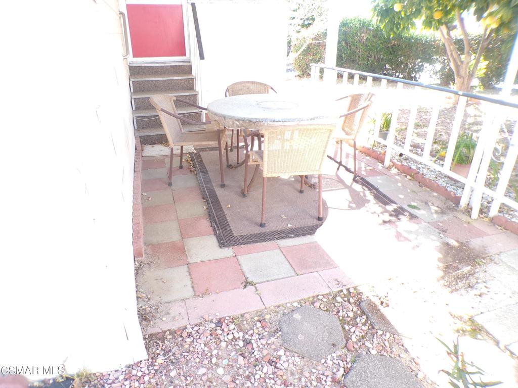 250 East Telegraph Road, Unit 220 Fillmore, CA 93015 - Photo 22 of 24 a dining room with furniture and a floor to ceiling window
