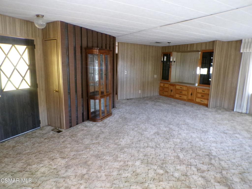 250 East Telegraph Road, Unit 220 Fillmore, CA 93015 - Photo 7 of 24 an empty room with closet and mirror