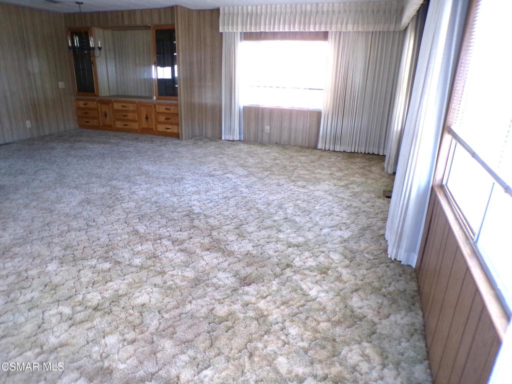 250 East Telegraph Road, Unit 220 Fillmore, CA 93015 - Photo 8 of 24 a view of room with window and hardwood floor