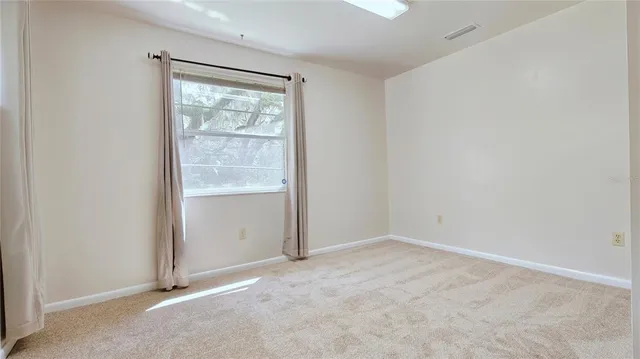 an empty room with an outdoor space