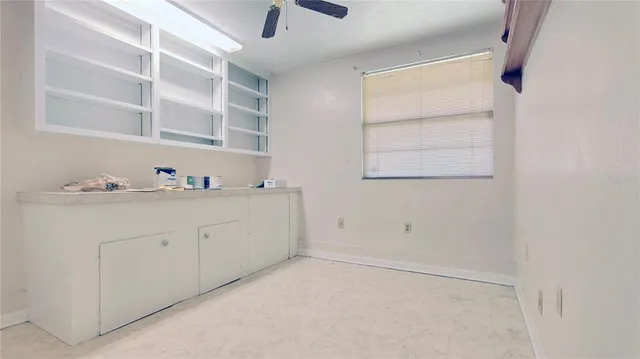 a room with a cabinets and washer dryer