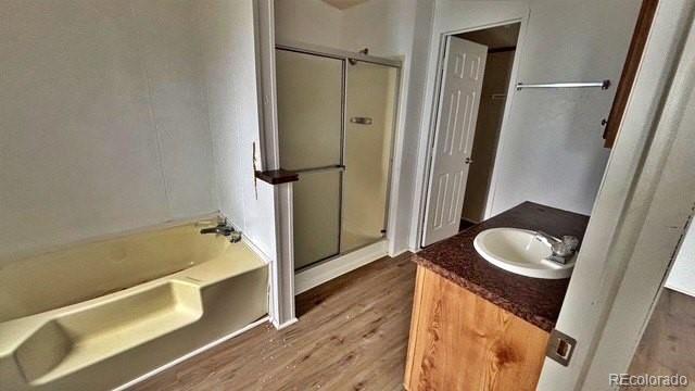 1212 Reed Lane La Junta, CO 81050 - Photo 11 of 23 a bathroom with a tub sink and mirror